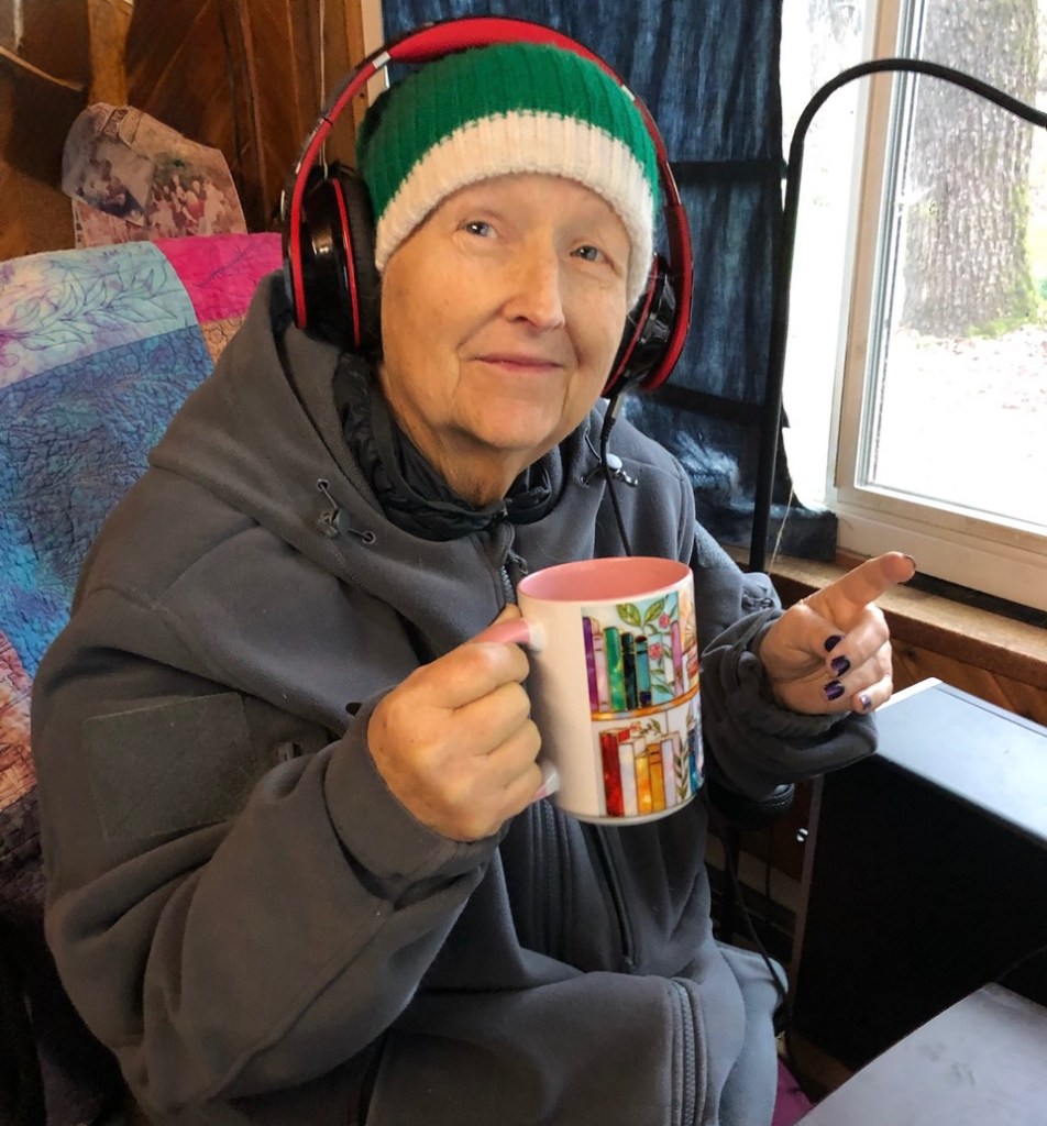 Virginia, happy at home, watching videos on quilting. 